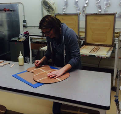 Braces are glued and placed into a vacuum table to dry. Here, Courtney details the braces once dried. 