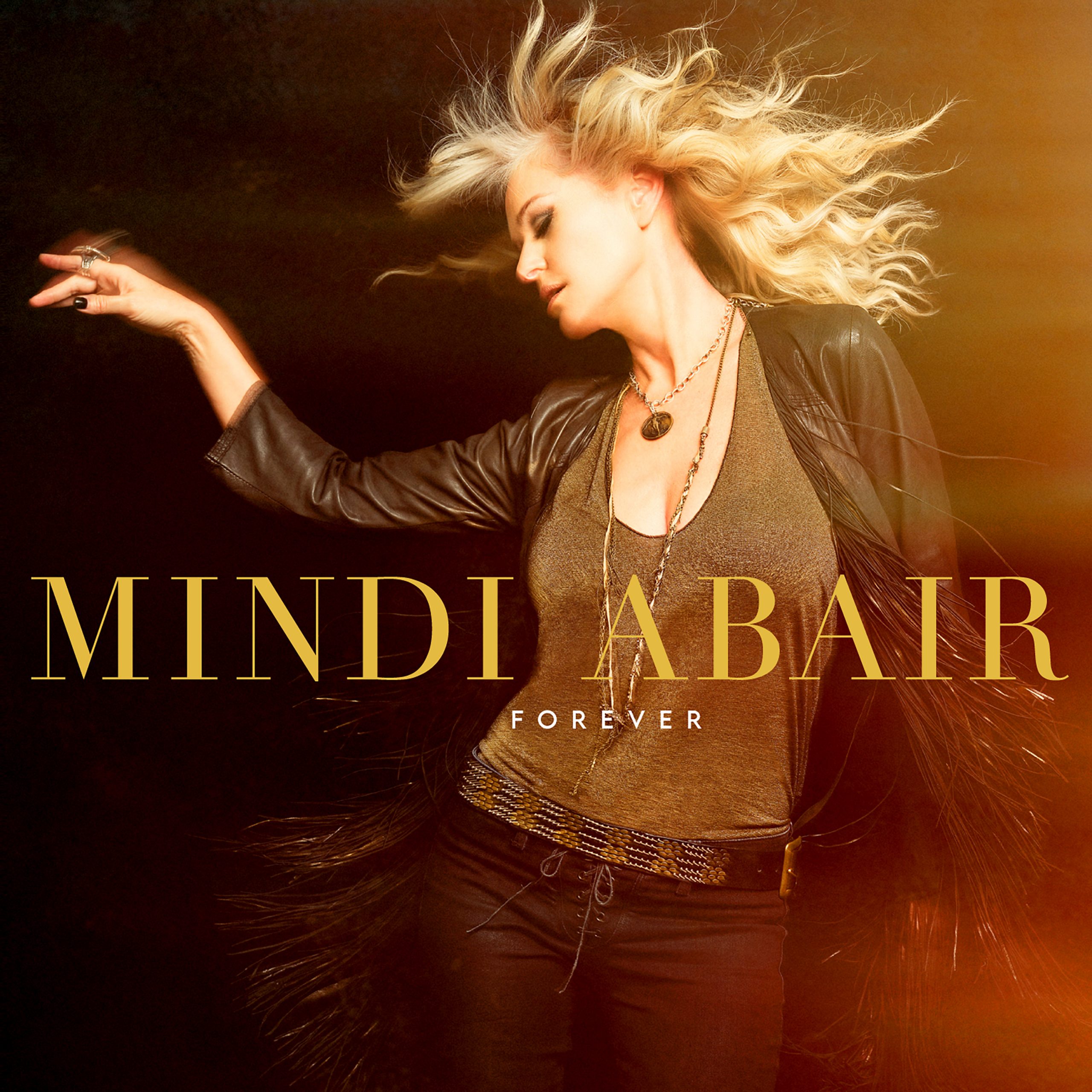 Cover image of Mindi Abair's album; a woman dances with her hair whipping around her face.